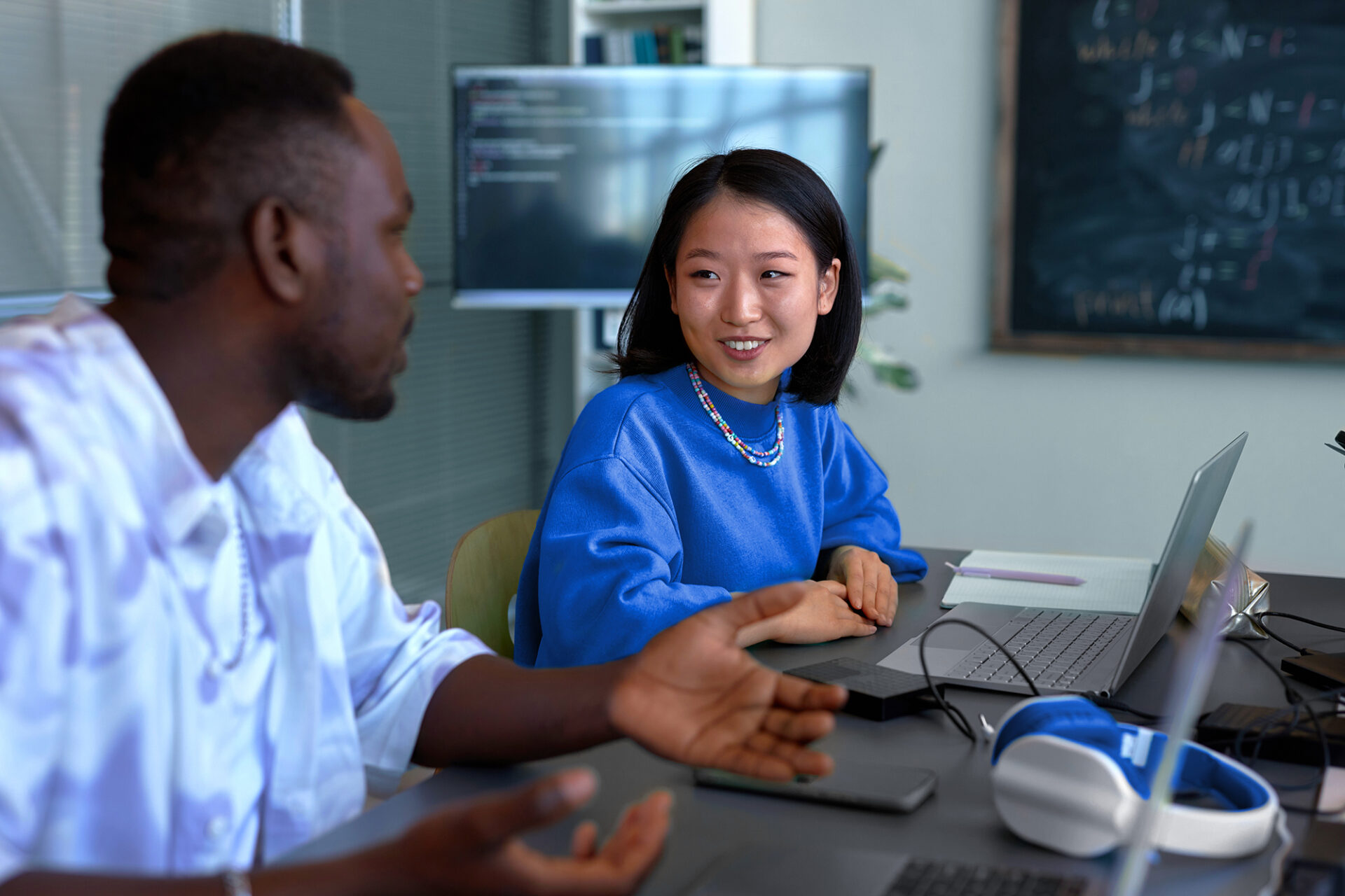 Coworkers collaborating on Trintech AI financial close solution to streamline accounting and reporting tasks